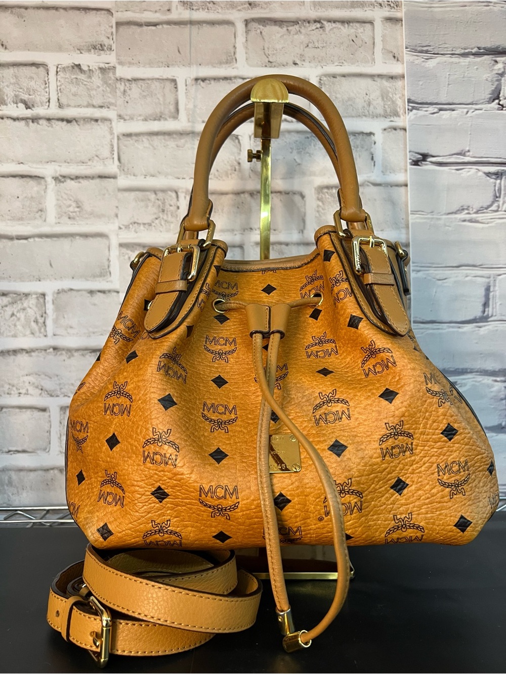 MCM Cognac Bucket Logo Print Drawstring Satchel with Gold Hardware